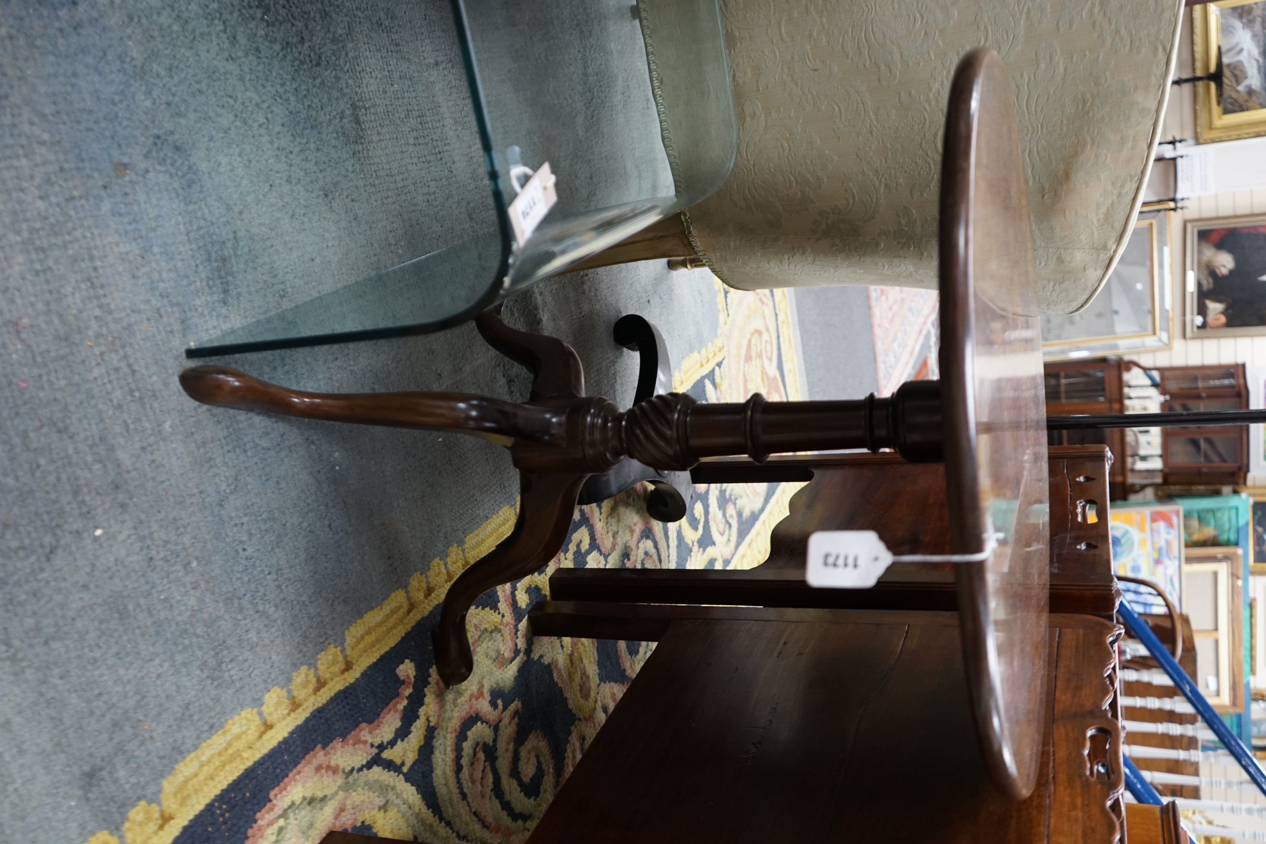 A George III circular mahogany tilt top tripod tea table, diameter 65cm, height 72cm